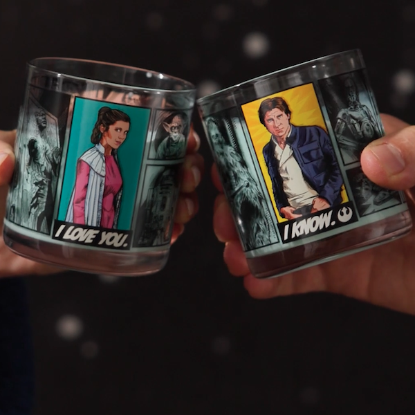 A woman's hand holds a drinking glass featuring Star WarsTM Princess Leia and reads, 